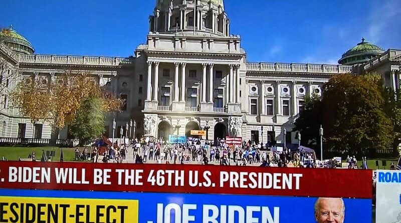 Joe Biden elected as the 46th U.S. President shown on a news banner.