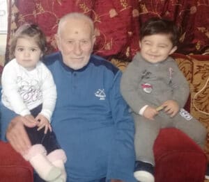 The illuminated facade of Al-Ajami Restaurant at night.