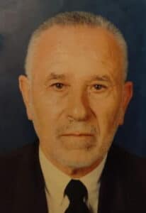 The illuminated facade of Al-Ajami Restaurant at night.