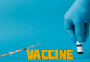 Syringe poised to inject vaccine text against blue background.