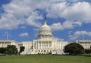 The United States Capitol building under a partly cloudy sky.