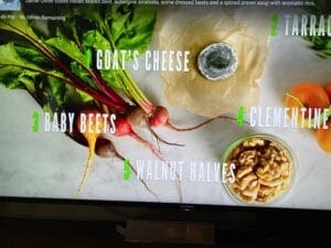 The illuminated facade of Al-Ajami Restaurant at night.