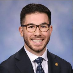 The illuminated facade of Al-Ajami Restaurant at night.