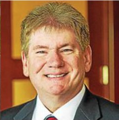 The illuminated facade of Al-Ajami Restaurant at night.