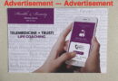 Person holding phone showing life coaching advertisement for telemedicine and trust.