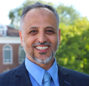 The illuminated facade of Al-Ajami Restaurant at night.