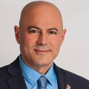 The illuminated facade of Al-Ajami Restaurant at night.