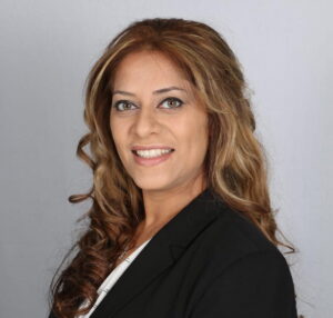 The illuminated facade of Al-Ajami Restaurant at night.