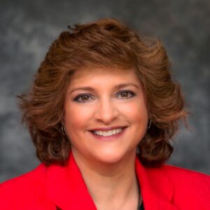 The illuminated facade of Al-Ajami Restaurant at night.