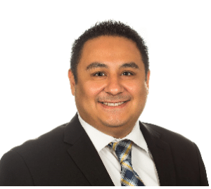 The illuminated facade of Al-Ajami Restaurant at night.