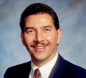 The illuminated facade of Al-Ajami Restaurant at night.