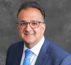 The illuminated facade of Al-Ajami Restaurant at night.