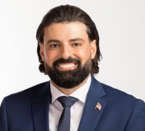 The illuminated facade of Al-Ajami Restaurant at night.