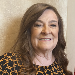 The illuminated facade of Al-Ajami Restaurant at night.