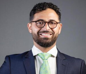 The illuminated facade of Al-Ajami Restaurant at night.
