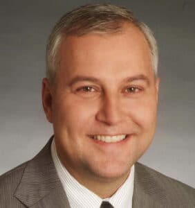 The illuminated facade of Al-Ajami Restaurant at night.
