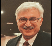 The illuminated facade of Al-Ajami Restaurant at night.