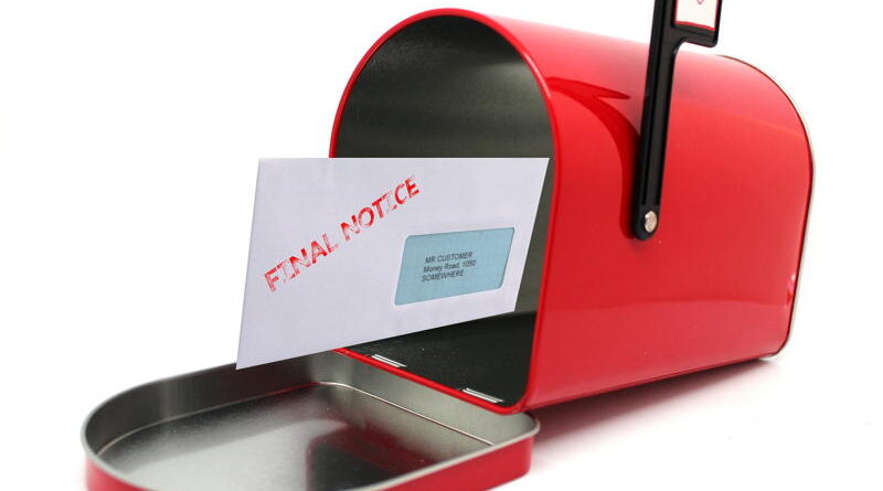 Red mailbox with an open door and a letter inside.