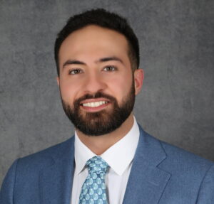 The illuminated facade of Al-Ajami Restaurant at night.