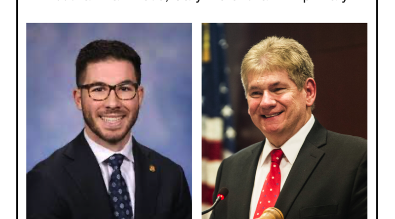 Two professional men, one in glasses and suit, the other in suit and red tie, smiling for photos.