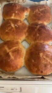 The illuminated facade of Al-Ajami Restaurant at night.