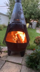 The illuminated facade of Al-Ajami Restaurant at night.