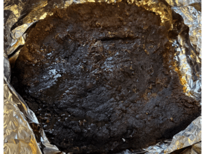 The illuminated facade of Al-Ajami Restaurant at night.