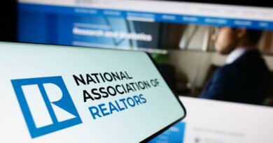Close-up of a phone displaying the National Association of Realtors logo.