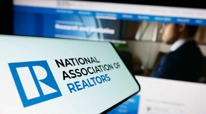 Close-up of a phone displaying the National Association of Realtors logo.