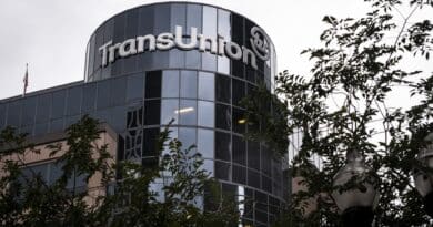 Modern TransUnion office building with reflective glass windows.