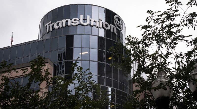 Modern TransUnion office building with reflective glass windows.