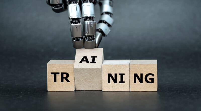 Robot assembling blocks to form 'AI TRAINING'.