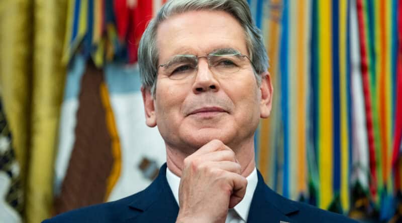 A distinguished man in a suit with a thoughtful expression.